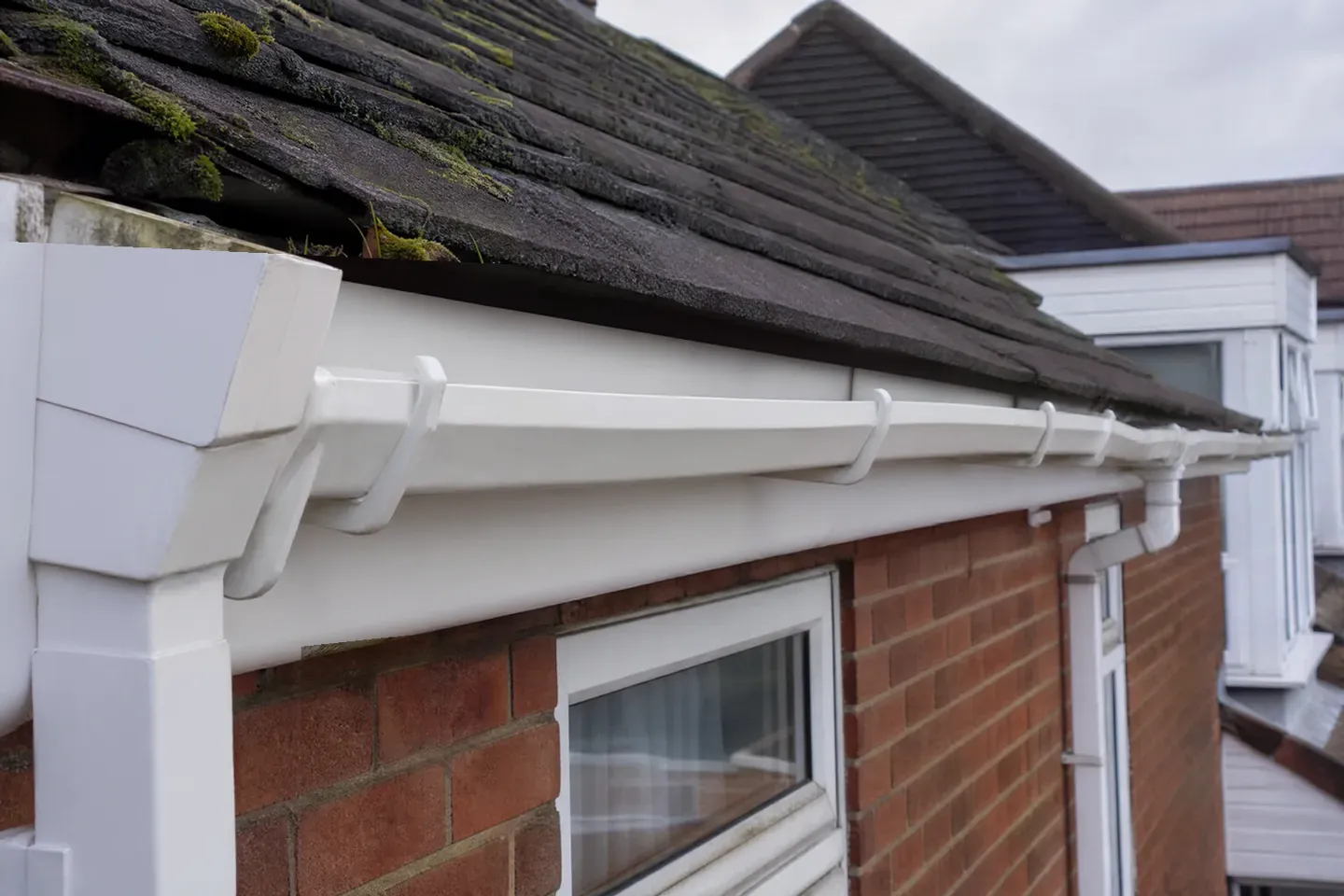 The same gutter run completely clear and clean after a professional SkyVac clearance, fascia bright white again