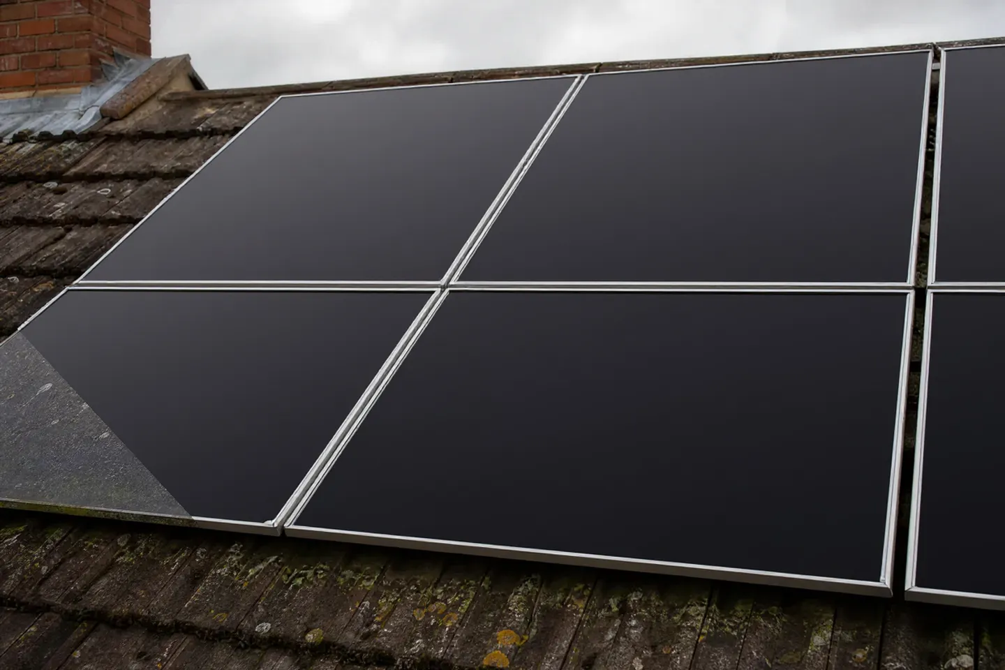 The same solar panels spotless, deep black and gleaming after professional pure water cleaning