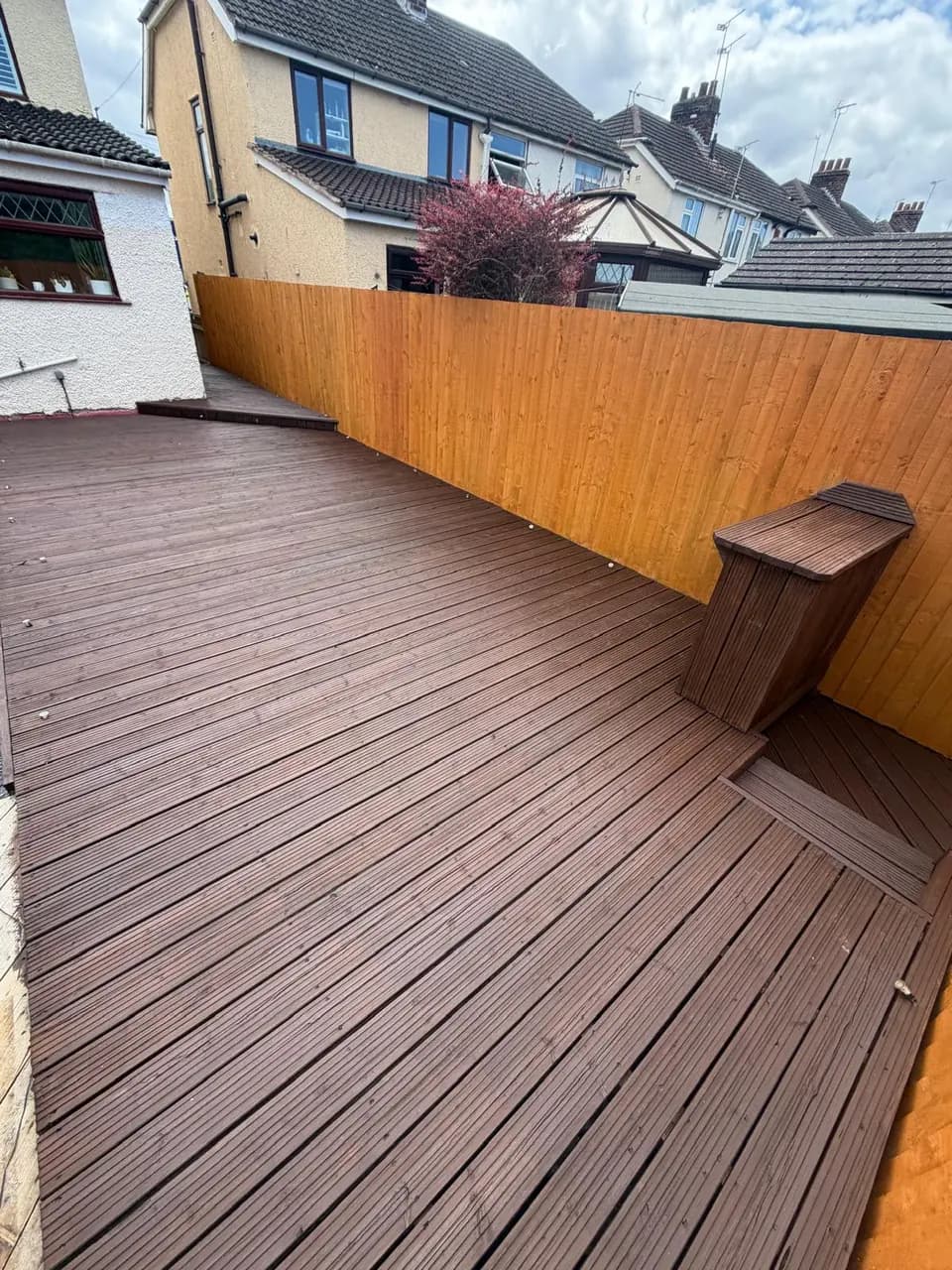 Finished decking, steps and garden fencing after full exterior timber treatment